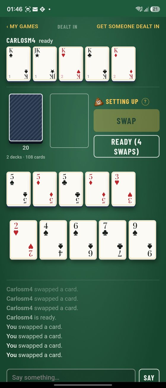 Setting up: four fives and a 3 face-up against four kings and a joker